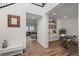 Hallway view showing an open concept with a living room and an office space at 14102 Night Owl Ln, Parker, CO 80134