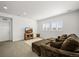 Spacious living room with neutral tones, comfortable seating, and bright natural light at 14102 Night Owl Ln, Parker, CO 80134