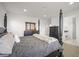Well-lit main bedroom featuring a four-poster bed, dresser, and convenient access to the bathroom at 14102 Night Owl Ln, Parker, CO 80134