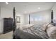 Elegantly appointed main bedroom with a four-poster bed and an en-suite bathroom at 14102 Night Owl Ln, Parker, CO 80134
