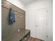 Functional mud room features a built-in bench with storage, coat hooks, and stylish wainscoting at 14102 Night Owl Ln, Parker, CO 80134