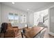 Bright home office with shuttered windows, wood floors, and a glass door at 14102 Night Owl Ln, Parker, CO 80134