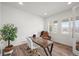 Bright office with wood floors, shuttered windows, and a comfortable reading chair at 14102 Night Owl Ln, Parker, CO 80134
