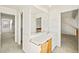 Bathroom vanity with large mirror and wood cabinets at 1995 S Xanadu Way, Aurora, CO 80014