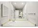 Well-lit bathroom featuring a large mirror and vanity at 1995 S Xanadu Way, Aurora, CO 80014