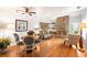 Open-concept living and dining area with hardwood floors at 1995 S Xanadu Way, Aurora, CO 80014