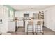 Modern kitchen with white cabinets, stainless steel appliances and a breakfast bar at 3638 N Elizabeth St, Denver, CO 80205