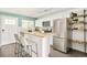 Well-equipped kitchen features stainless steel appliances, breakfast bar, and stylish shelving at 3638 N Elizabeth St, Denver, CO 80205
