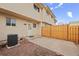 Fenced backyard featuring a concrete patio offers privacy and space for outdoor entertaining at 1188 S Troy St, Aurora, CO 80012