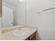 Bathroom featuring a laminate vanity and large mirror at 1188 S Troy St, Aurora, CO 80012