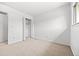 Bedroom with neutral carpet and double bi-fold closet doors; plenty of natural light at 1188 S Troy St, Aurora, CO 80012