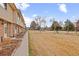 Townhome exterior view with adjacent common green area, showcasing a Gathering-friendly environment at 1188 S Troy St, Aurora, CO 80012