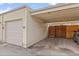 Attached one-car garage and carport of this charming single-Gathering home at 1188 S Troy St, Aurora, CO 80012