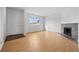 Spacious living room featuring laminate floors and a cozy fireplace, perfect for relaxation and gatherings at 1188 S Troy St, Aurora, CO 80012