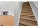 Carpeted staircase leading to an upper level in a home at 1188 S Troy St, Aurora, CO 80012