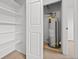 Water heater closet with shelves to the left, offering additional storage space at 1188 S Troy St, Aurora, CO 80012