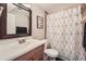 Bathroom with shower/tub combo and wood vanity at 1517 S Owens St # 7, Denver, CO 80232