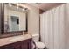 Clean bathroom with shower/tub combo and granite vanity at 1517 S Owens St # 7, Denver, CO 80232