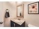 Small bathroom with vanity, toilet, and decorative framed print at 1517 S Owens St # 7, Denver, CO 80232