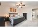 King-size bedroom with ceiling fan and access to another room at 1517 S Owens St # 7, Denver, CO 80232