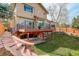 Spacious backyard featuring a large deck and patio area, perfect for entertaining and outdoor living at 8101 E Dartmouth Ave # 22, Denver, CO 80231
