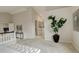 Bright bedroom area with a leafy plant and a glimpse into the attached bathroom at 8101 E Dartmouth Ave # 22, Denver, CO 80231