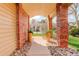 Inviting front entrance featuring brick columns, decorative planters, and a charming walkway at 8101 E Dartmouth Ave # 22, Denver, CO 80231