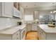 Bright kitchen featuring granite counters and modern appliances at 8101 E Dartmouth Ave # 22, Denver, CO 80231