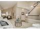 Open-concept living space with view of dining area with modern light fixtures and staircase at 8101 E Dartmouth Ave # 22, Denver, CO 80231
