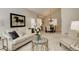 Bright living room and dining area featuring neutral decor and plush carpeting for a cozy atmosphere at 8101 E Dartmouth Ave # 22, Denver, CO 80231