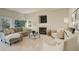 Bright living room features a cozy fireplace and comfortable seating at 8101 E Dartmouth Ave # 22, Denver, CO 80231
