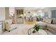 Open floor plan connecting living area and kitchen featuring a built-in wine rack and plush seating at 8101 E Dartmouth Ave # 22, Denver, CO 80231
