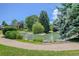Scenic pond with lush landscaping, greenery, and walking path, set within a well-maintained community at 8101 E Dartmouth Ave # 22, Denver, CO 80231