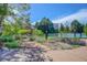 Community tennis courts surrounded by lush greenery and landscaping for outdoor recreation at 8101 E Dartmouth Ave # 22, Denver, CO 80231
