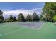 Community tennis courts with well-maintained green surfaces and fencing at 8101 E Dartmouth Ave # 22, Denver, CO 80231