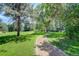 Inviting community path surrounded by lush greenery and mature trees at 8101 E Dartmouth Ave # 22, Denver, CO 80231