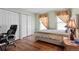 Comfortable bedroom with wood floors, dual closets, and two sunny windows at 18982 E 46Th Ave, Denver, CO 80249