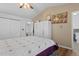 Bedroom with wood floor and vaulted ceiling; closet and bathroom access visible at 18982 E 46Th Ave, Denver, CO 80249