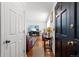 Inviting entryway with hardwood floors, a view of the living room, and a stylish front door at 18982 E 46Th Ave, Denver, CO 80249