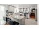 Charming kitchen features a granite island and stainless steel appliances at 18982 E 46Th Ave, Denver, CO 80249