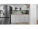 Modern kitchen featuring stainless steel appliances, granite countertops, and subway tile backsplash at 18982 E 46Th Ave, Denver, CO 80249