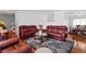Comfortable living room features hardwood floors, a fireplace, and plush seating at 18982 E 46Th Ave, Denver, CO 80249