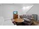 Inviting living room with a white couch, floral sofa, tv and a wooden coffee table at 18982 E 46Th Ave, Denver, CO 80249