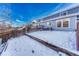 View of backyard with snow and wooden fence at 5780 Raleigh Cir, Castle Rock, CO 80104