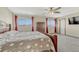 Spacious bedroom with a wooden bed frame and ceiling fan at 5780 Raleigh Cir, Castle Rock, CO 80104