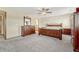 Spacious Primary bedroom with wood furniture and carpeted floor at 5780 Raleigh Cir, Castle Rock, CO 80104