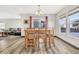 Bright dining area with wood table and chairs, hardwood floors, and view to living room at 5780 Raleigh Cir, Castle Rock, CO 80104