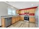 Kitchen features granite countertops, wood cabinets, and stainless steel appliances at 5780 Raleigh Cir, Castle Rock, CO 80104