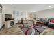 Living room with hardwood floors, fireplace, and comfy seating at 5780 Raleigh Cir, Castle Rock, CO 80104