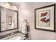 Clean bathroom with a vanity and mirror at 3317 S Elkhart St, Aurora, CO 80014